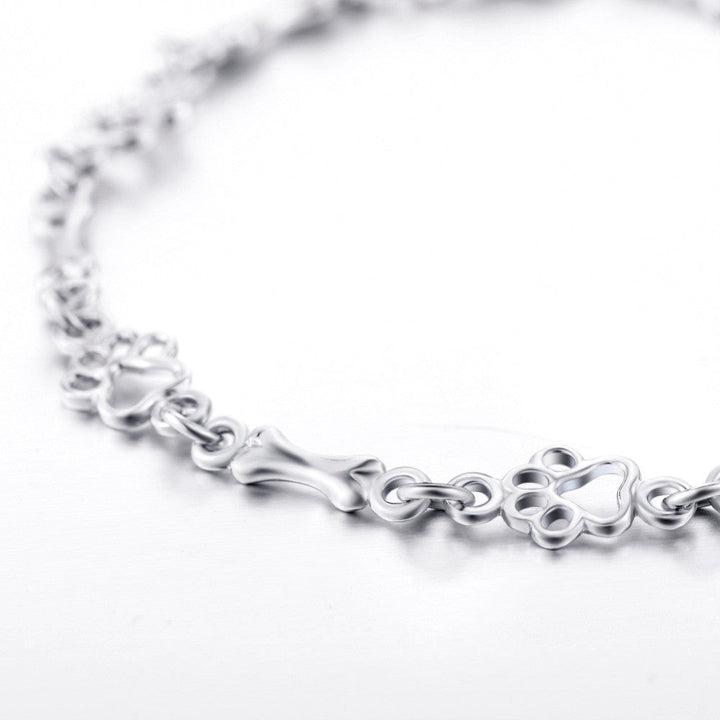 Pulsera con Patas de Perro Colgantes y Hueso de Plata Sin Tratamiento, Edición Limitada