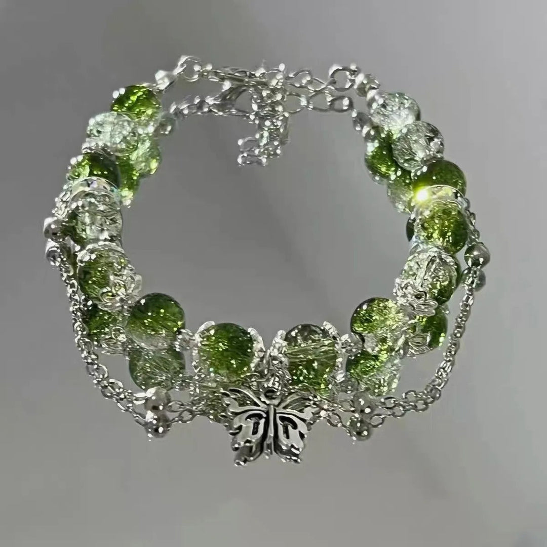 Pulsera retro con mariposa de plata y cuentas verdes