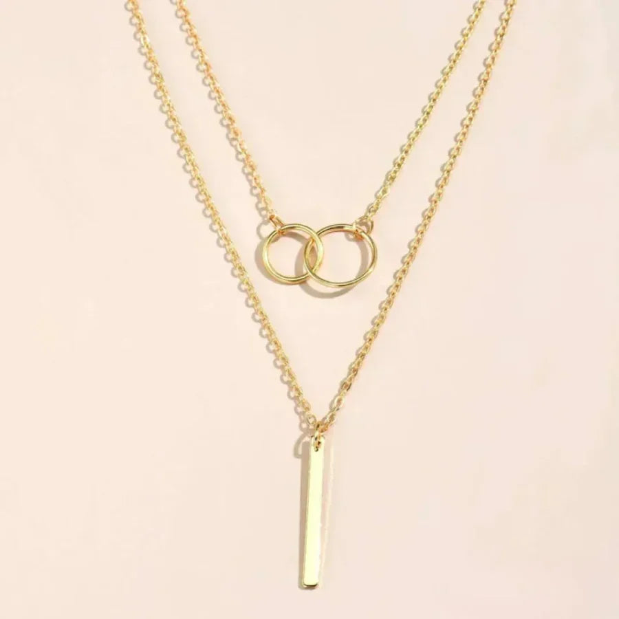 Collar retro dorado con colgante circular doble