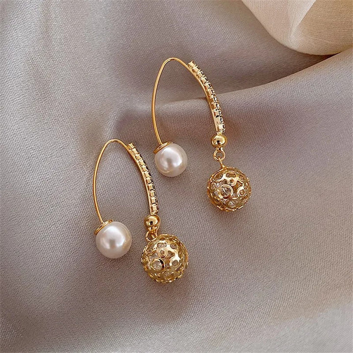 Pendientes colgantes retro en oro con margaritas