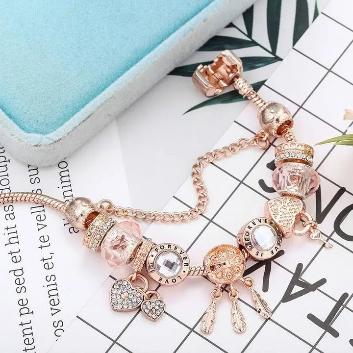 Pulsera Rosa Atrapa Sueños con Colgantes de Plata