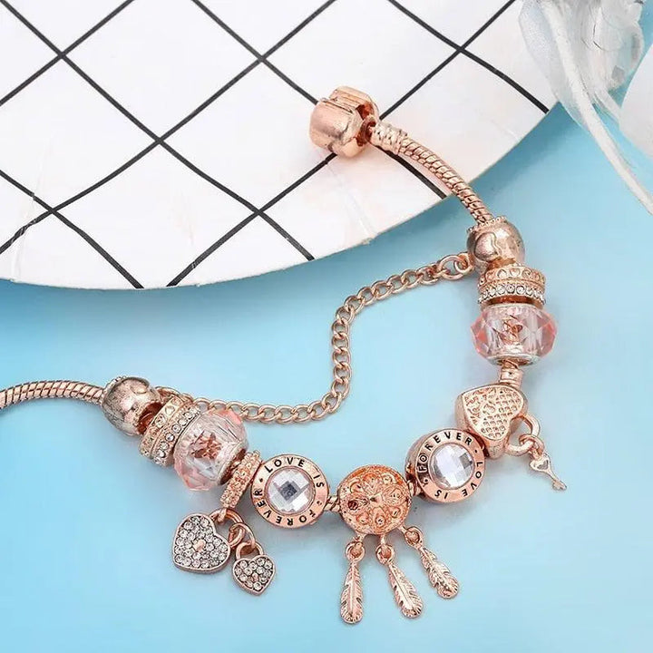 Pulsera Rosa Atrapa Sueños con Colgantes de Plata