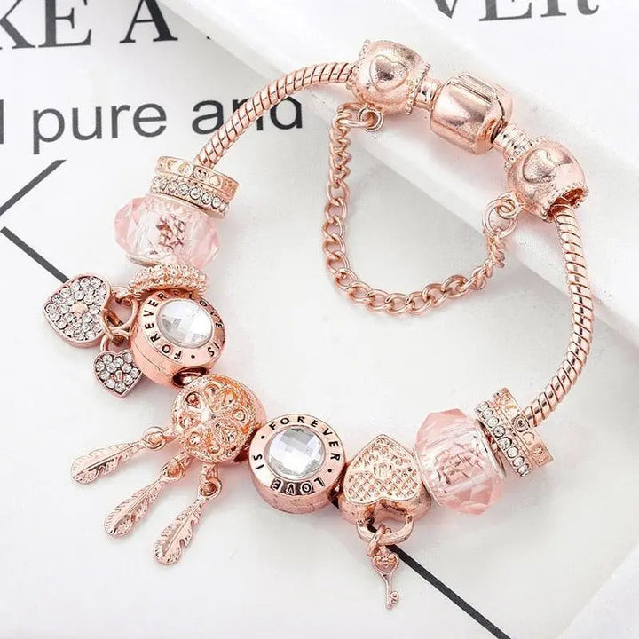 Pulsera Rosa Atrapa Sueños con Colgantes de Plata